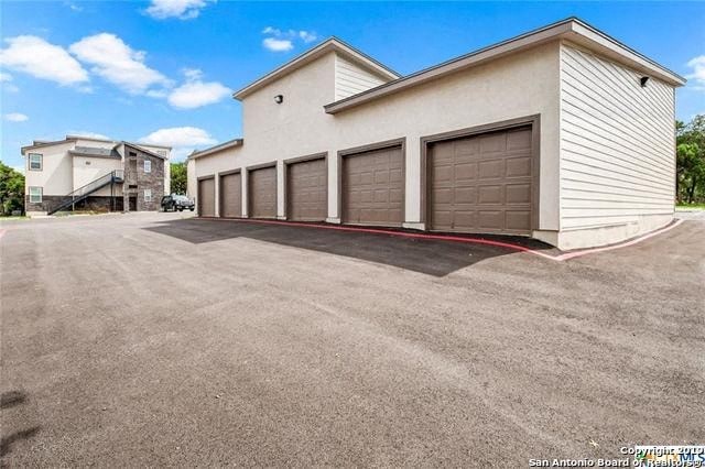 a building with a row of garage doors