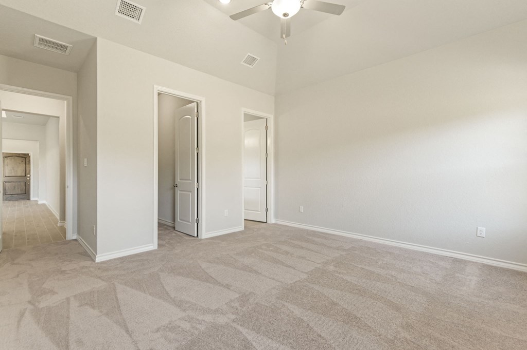 the spacious living room and dining room in a new home