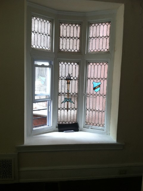 a close up of a window with stained glass