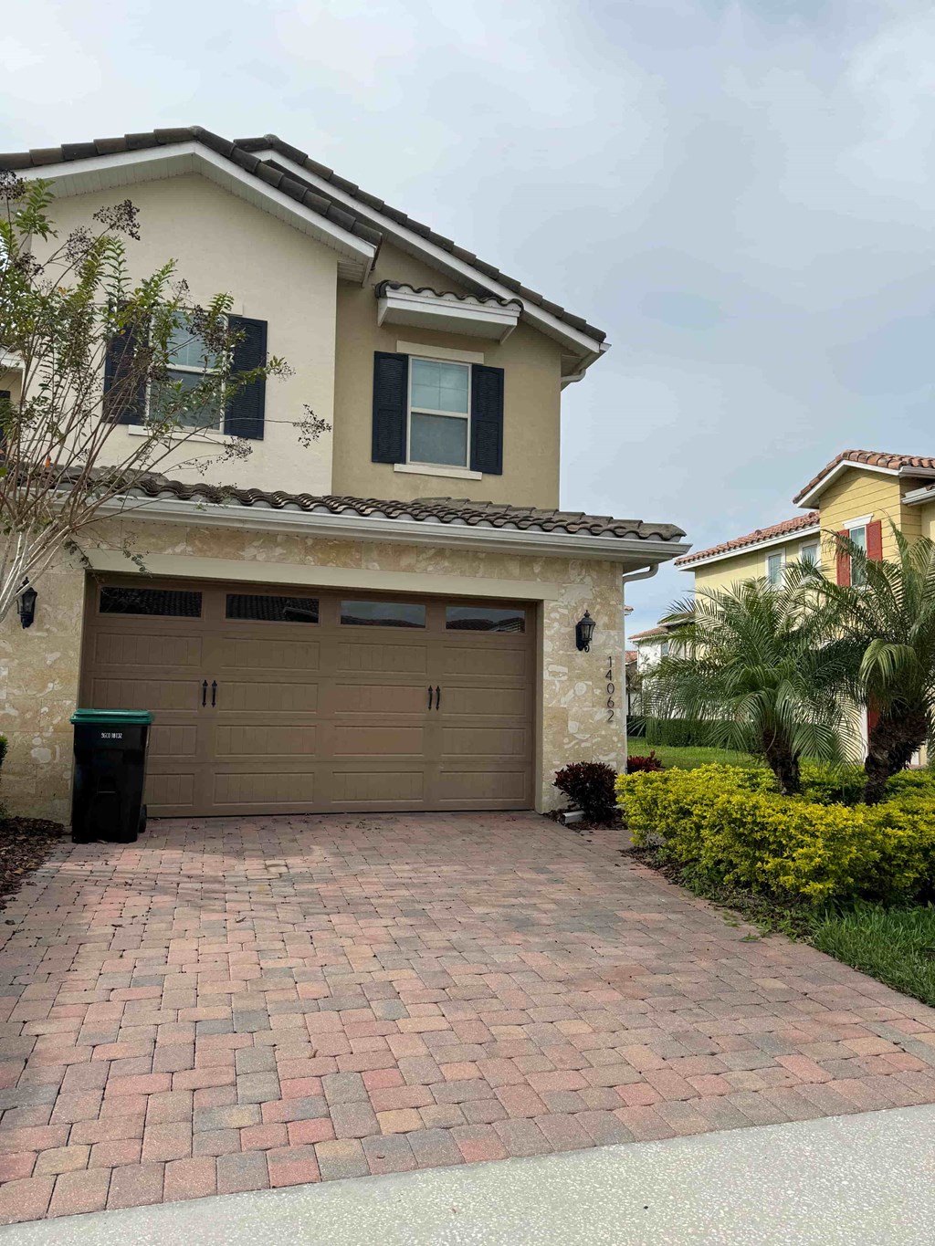 a house with a garage door and a driveway