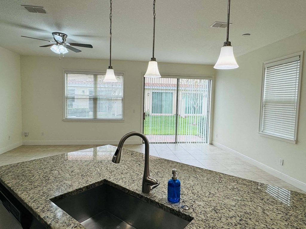 a kitchen with a sink and a window
