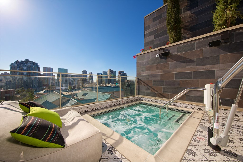 a rooftop jacuzzi with a view of the city