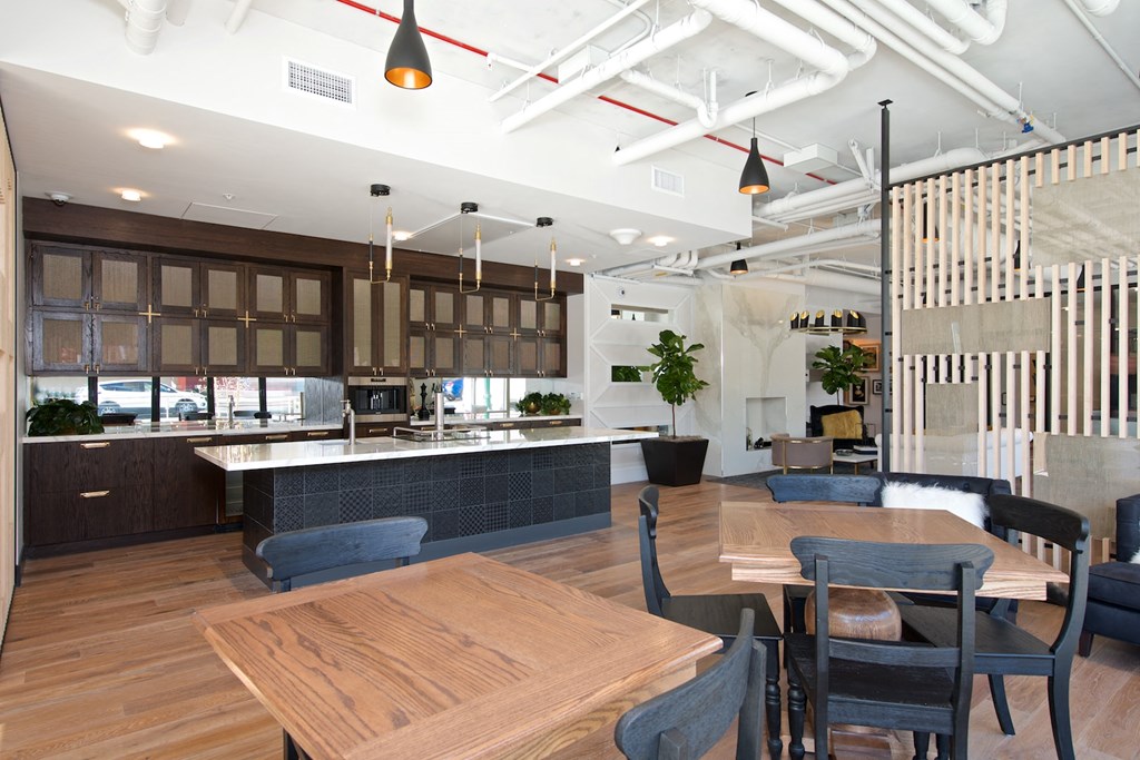 a large kitchen and dining room with a table and chairs