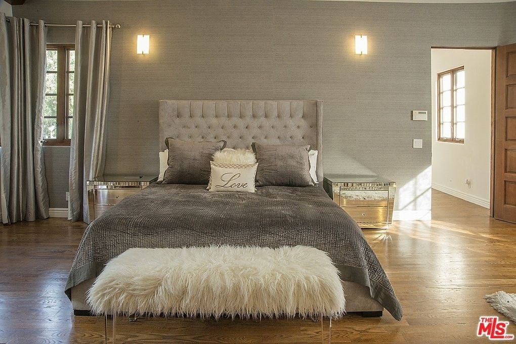 a bedroom with a bed and a rug