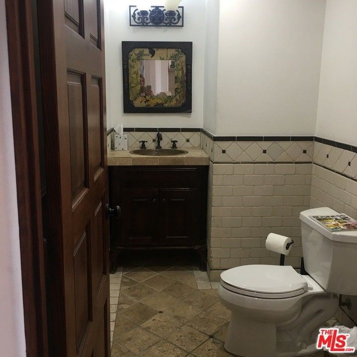 a bathroom with a toilet and a sink