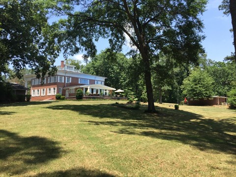 a large lawn in front of a large house