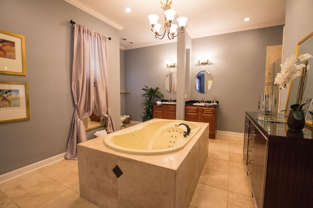 a large bathroom with a large tub and a shower