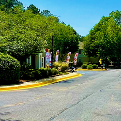 an empty street with flags in front of a house at Hidden Creek, Morrow