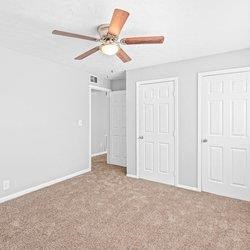 an empty room with ceiling fan at Uphill Flats, Decatur, Georgia