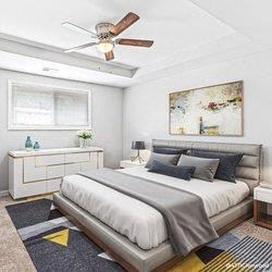 a bedroom with a bed and a ceiling fan at Uphill Flats, Georgia, 30032
