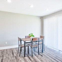 a dining room with a wooden table and chairs at Uphill Flats, Decatur, Georgia