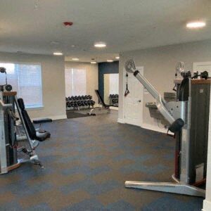 a gym with a lot of exercise equipment in it