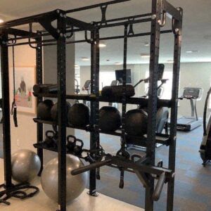 a gym with weights on a rack