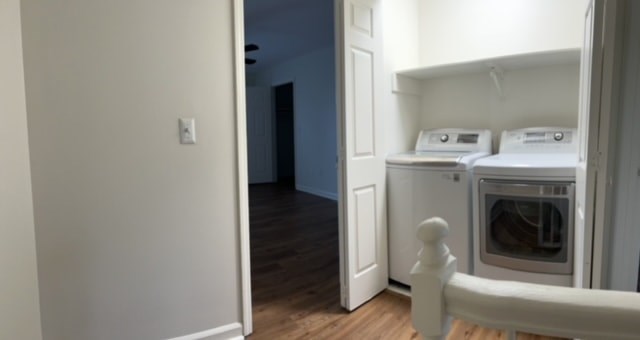 A white oven is built into a kitchen cabinet.