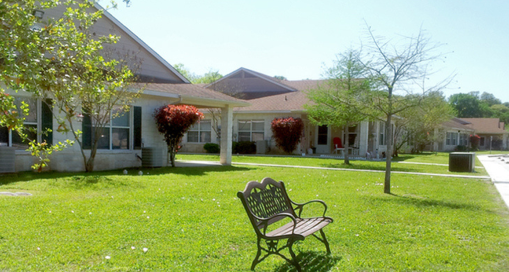 a park bench in front of a house