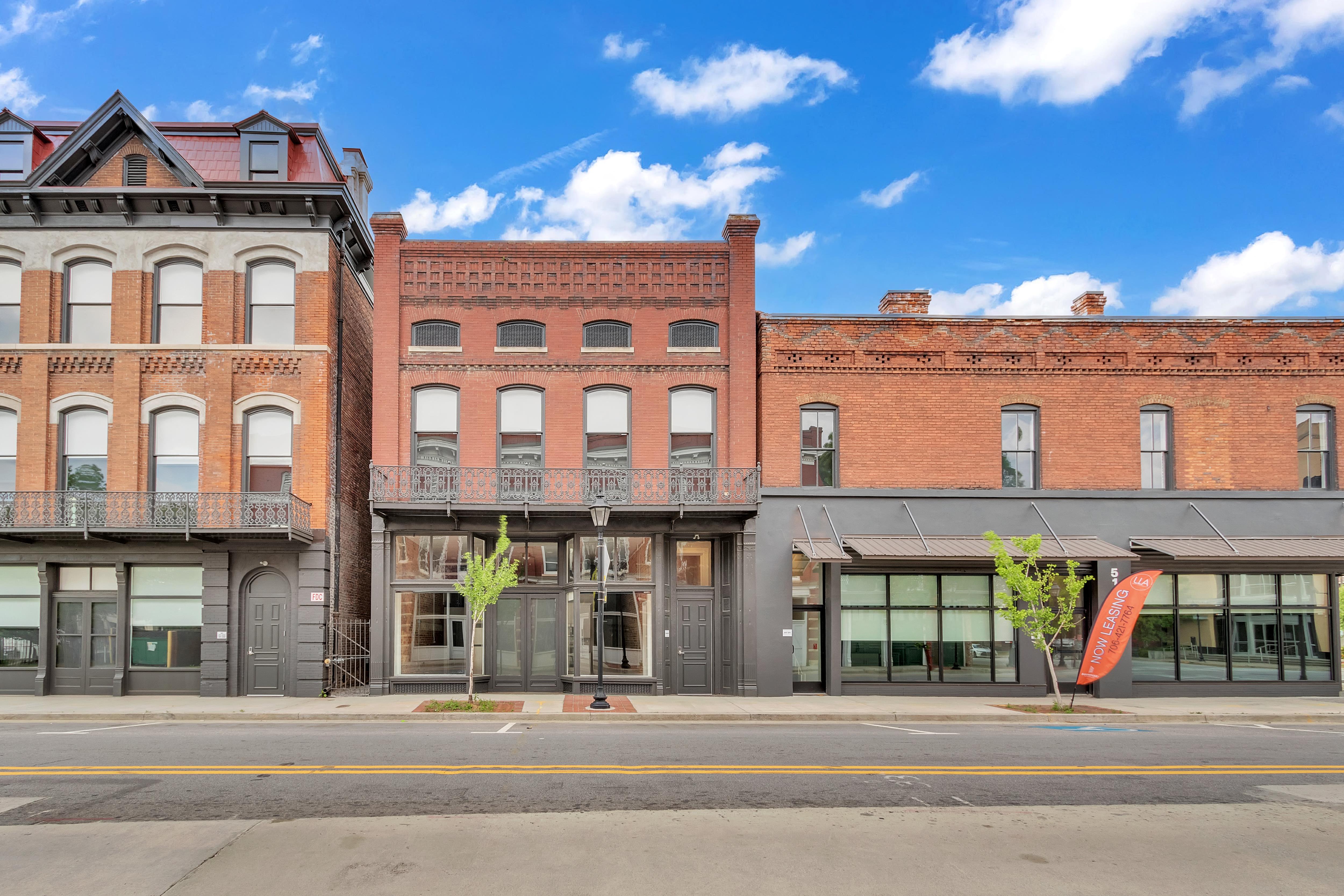 an old brick building on a city street