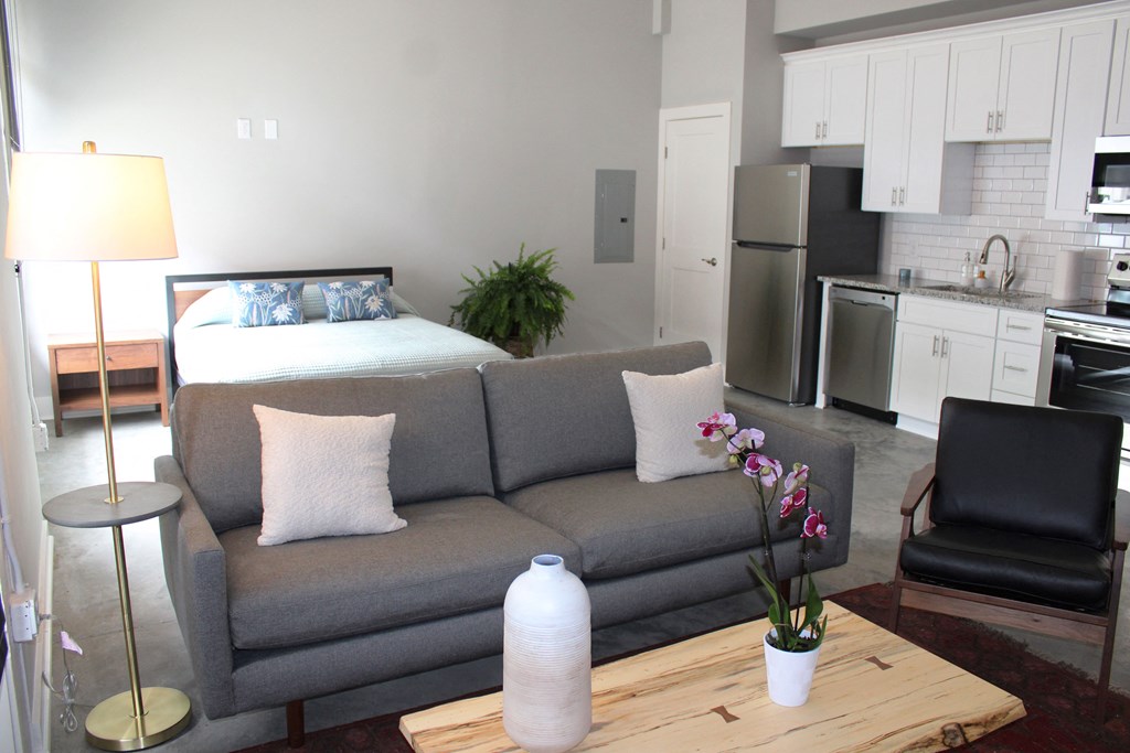 a living room with a couch and a table