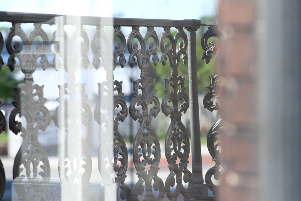 a close up of a metal railing on a balcony