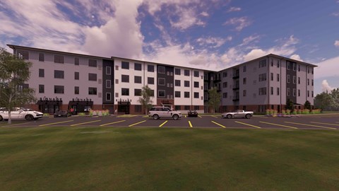 A large building with a parking lot in front of it.