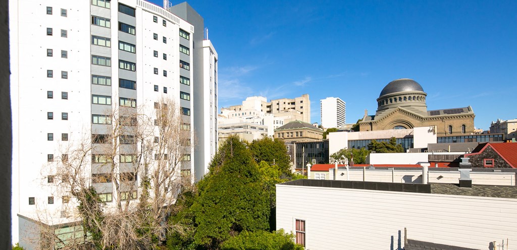 a view of the city from the roof of a building