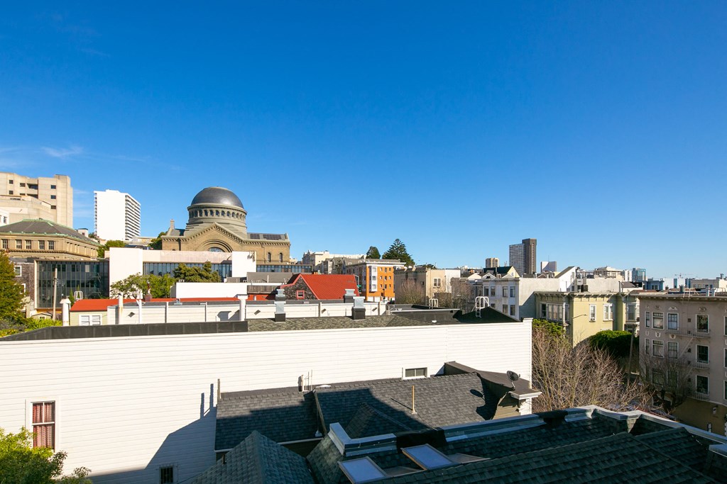 the view of the city from the roof of a building