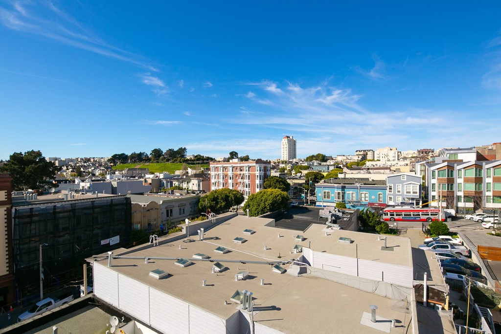 the view of the city from the roof of a building