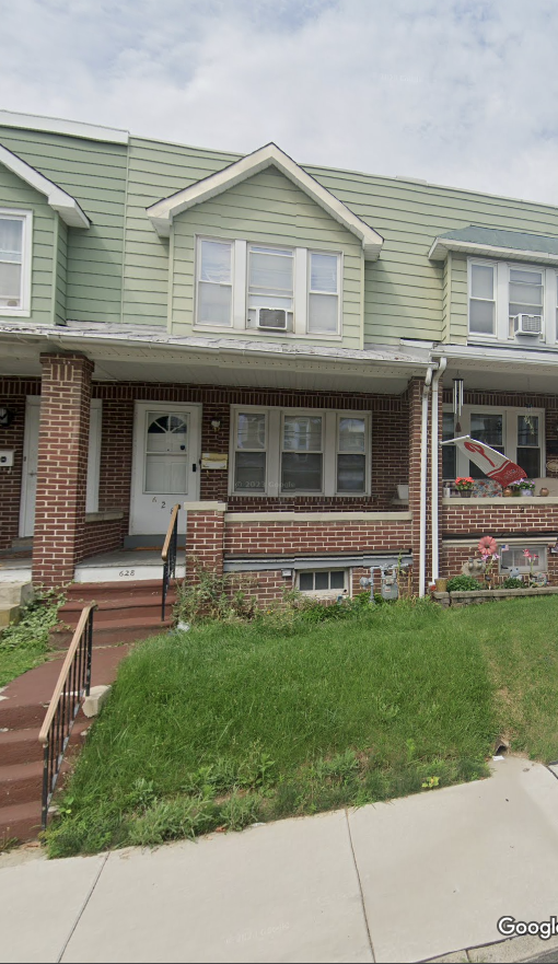 the front of a house with the front porch torn up