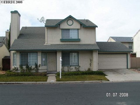 the front of a house with a garage