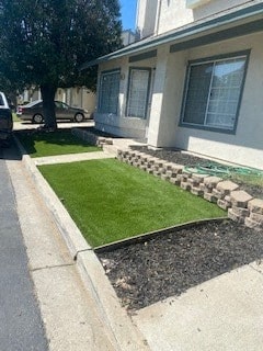 a house with green grass in front of it