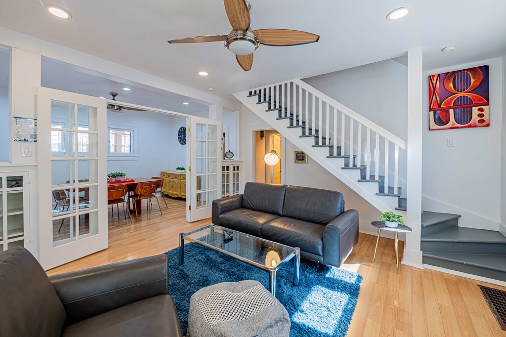 a living room with two couches and a glass coffee table