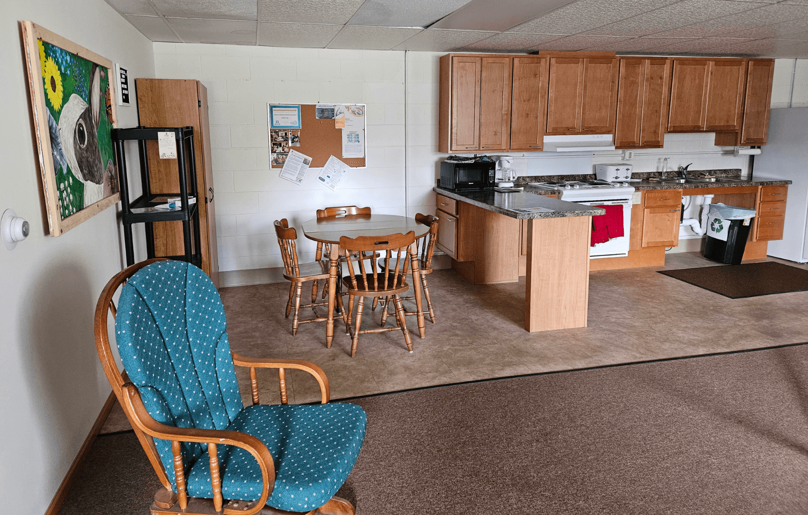 an open kitchen and dining room with a table and chairs