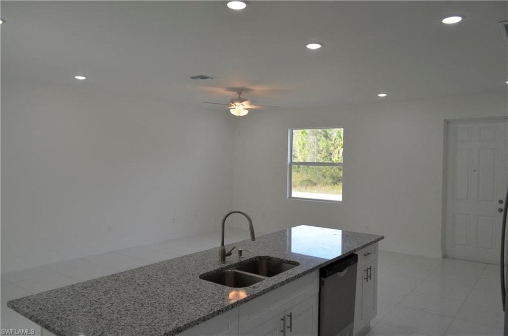 a kitchen with granite counter tops and a sink