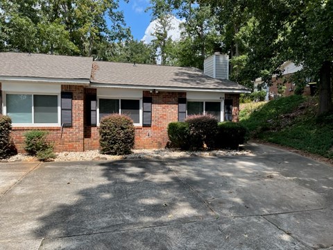 A house with a driveway in front of it.