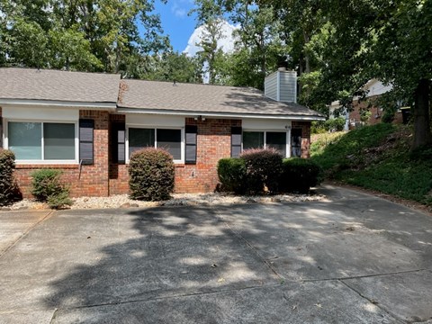 A house with a driveway in front of it.