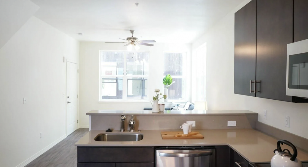 a kitchen with a sink and a window