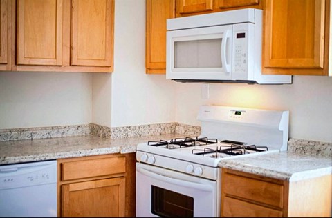 a kitchen with a stove and a microwave