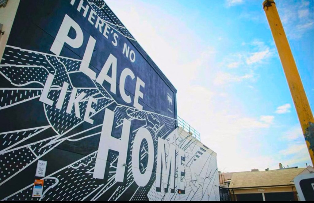 a street sign that reads there is no place like home