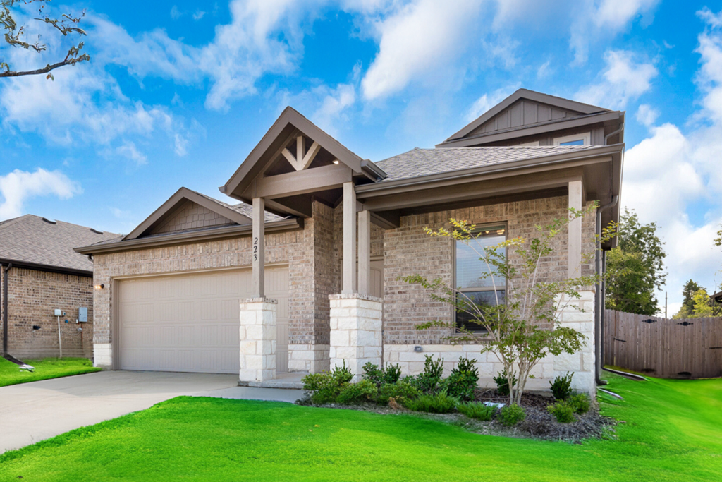 A house with a brown roof and a garage door.