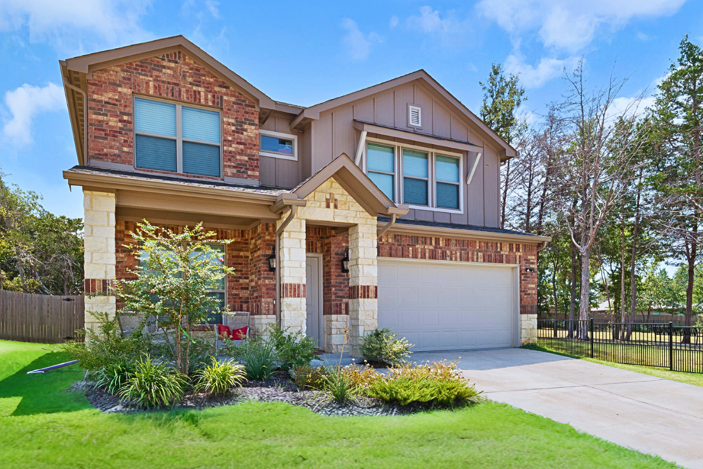 A house with a garage and a driveway.