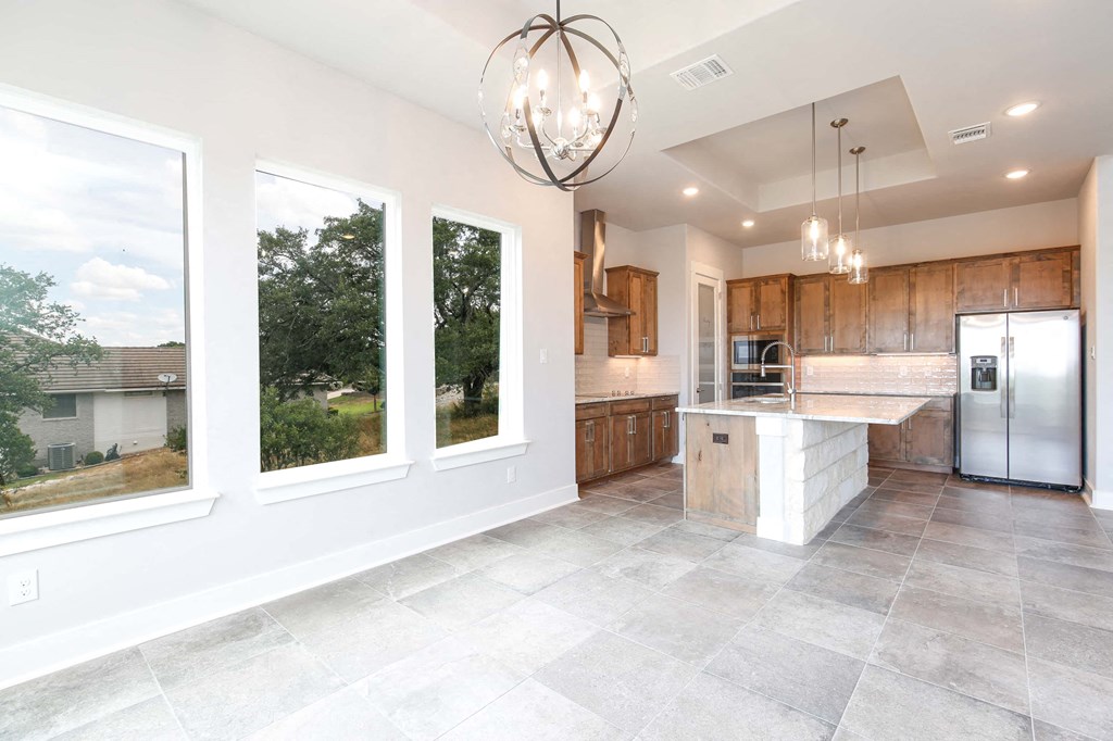 the kitchen is open to the dining room and living room