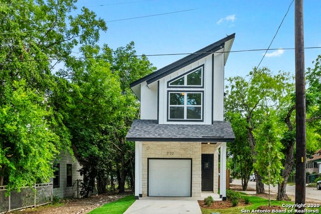 a white and gray house with a garage