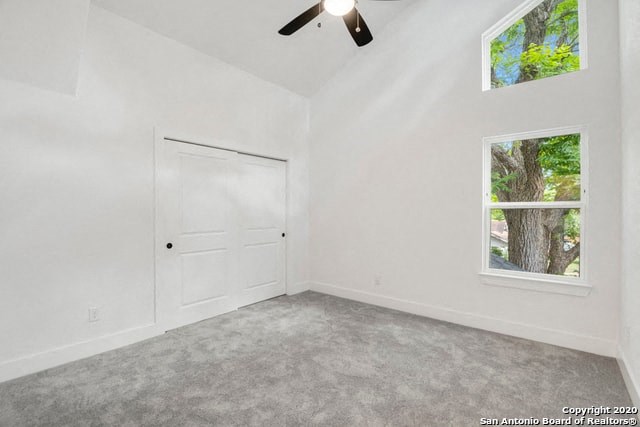 an empty room with a door and a window