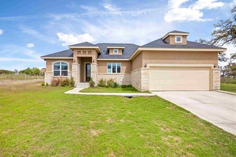 a house with a driveway and a garage door