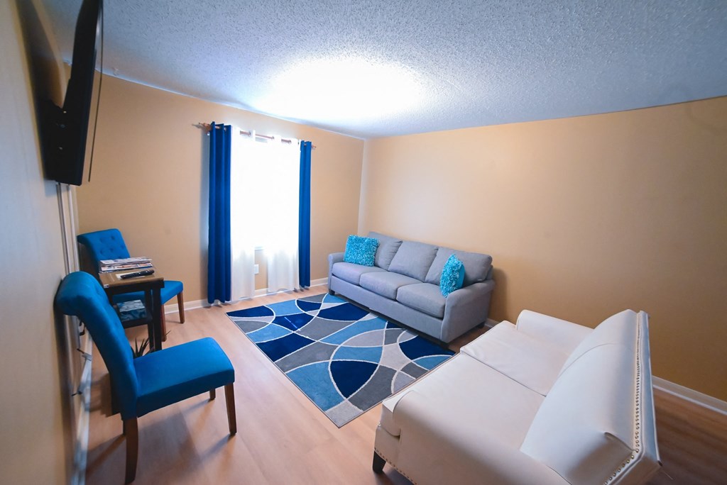 a living room with a couch and a table