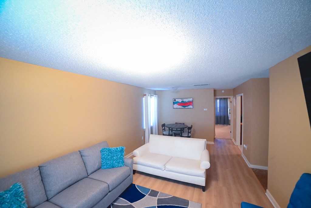 a living room with a couch and a table