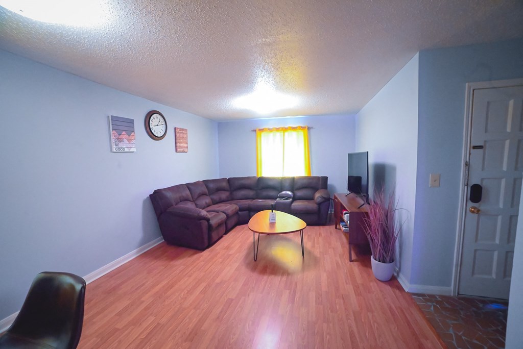 a living room with a couch and a table