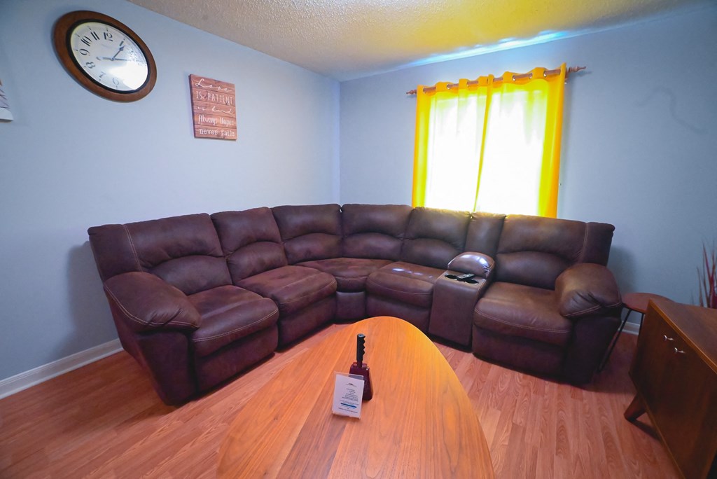 a living room with a couch and a table