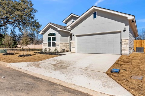 a house with a driveway and a garage door