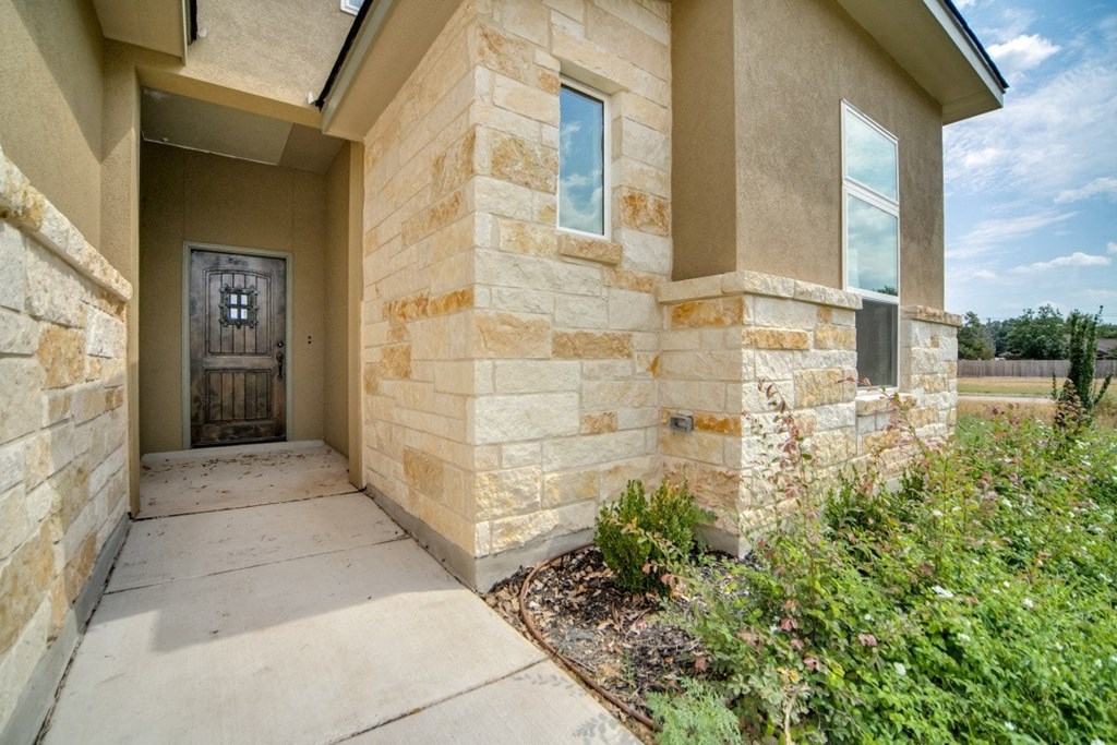 the walkway to the front door of a house