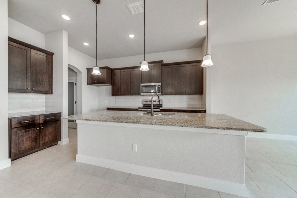 a kitchen with a counter top and a sink